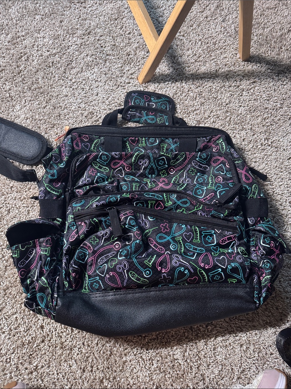 Nurse Mates Black Backpack with Teal Pink and Green Medical Icons never used.